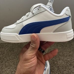 Puma Kids White Sneakers with Blue Side Stripe